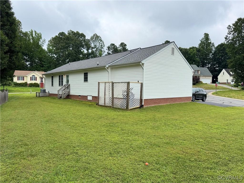 7873 Willow Walk Dr, Chesterfield, VA 23832 - back of house featuring entry steps, a lawn, crawl space, and roof with shingles