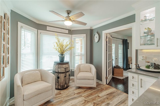 1442 Dorset Rd, Powhatan, VA 23139 - living area featuring wood finished floors, a ceiling fan, plenty of natural light, and crown molding