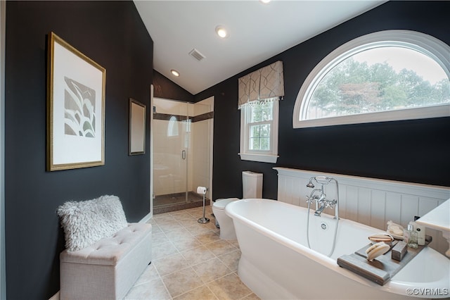 1442 Dorset Rd, Powhatan, VA 23139 - bathroom featuring a soaking tub, a stall shower, lofted ceiling, tile patterned floors, and a wainscoted wall