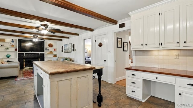 2711 Salisbury Rd, Midlothian, VA 23113 - kitchen featuring butcher block counters, ceiling fan, stone tile flooring, backsplash, and open floor plan