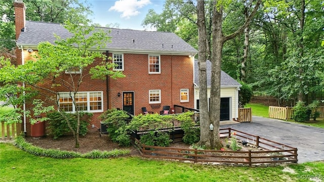 2711 Salisbury Rd, Midlothian, VA 23113 - rear view of property with driveway, an attached garage, a chimney, brick siding, and roof with shingles