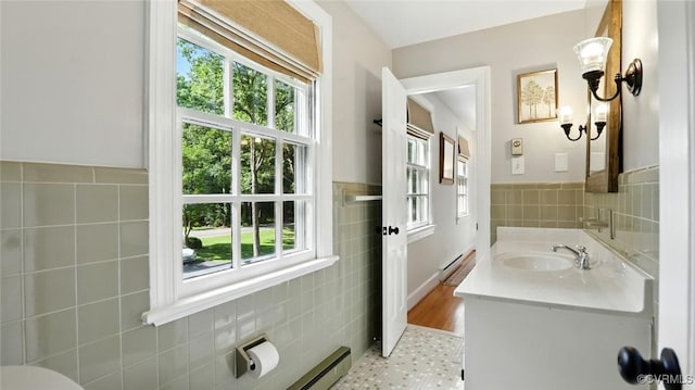 2711 Salisbury Rd, Midlothian, VA 23113 - bathroom with tile walls, vanity, tile patterned floors, wainscoting, and a baseboard heating unit