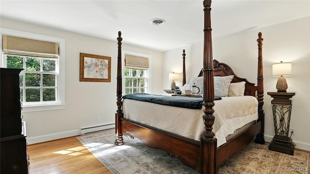 2711 Salisbury Rd, Midlothian, VA 23113 - bedroom with baseboard heating and light wood-style floors