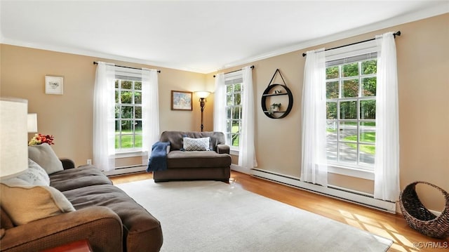 2711 Salisbury Rd, Midlothian, VA 23113 - living area featuring baseboard heating, plenty of natural light, wood finished floors, and ornamental molding