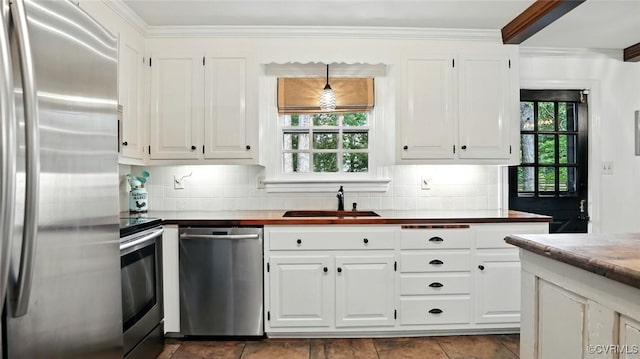 2711 Salisbury Rd, Midlothian, VA 23113 - kitchen featuring stainless steel appliances, plenty of natural light, backsplash, and ornamental molding