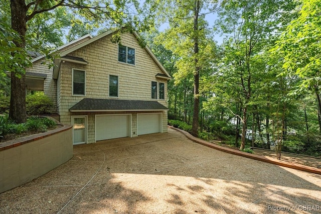 50 Tipers Cir, Heathsville, VA 22473 - view of side of home featuring an attached garage and driveway