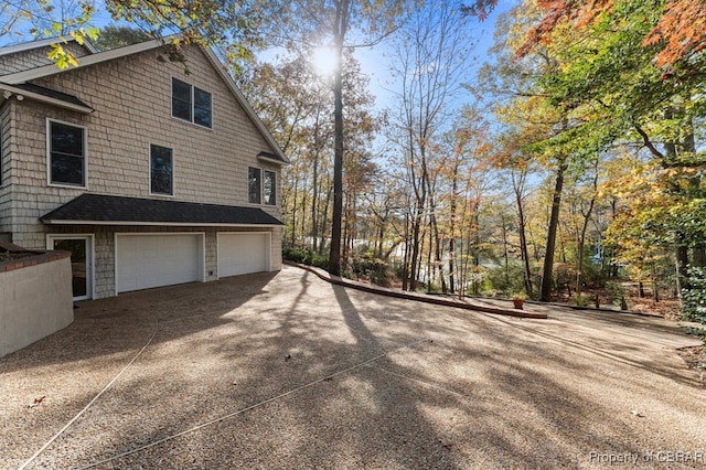 50 Tipers Cir, Heathsville, VA 22473 - view of property exterior featuring an attached garage and driveway