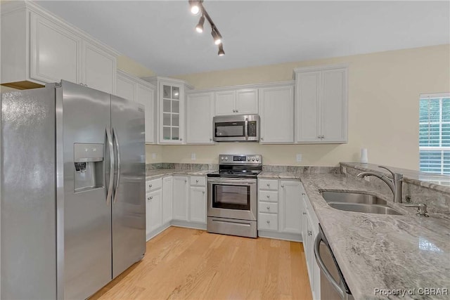 8619 Thomas Jefferson Way, Gloucester, VA 23061 - kitchen featuring stainless steel appliances, white cabinets, light wood-type flooring, and light stone counters