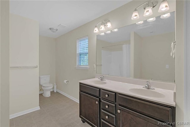 8619 Thomas Jefferson Way, Gloucester, VA 23061 - bathroom featuring double vanity, tile patterned flooring, and curtained shower