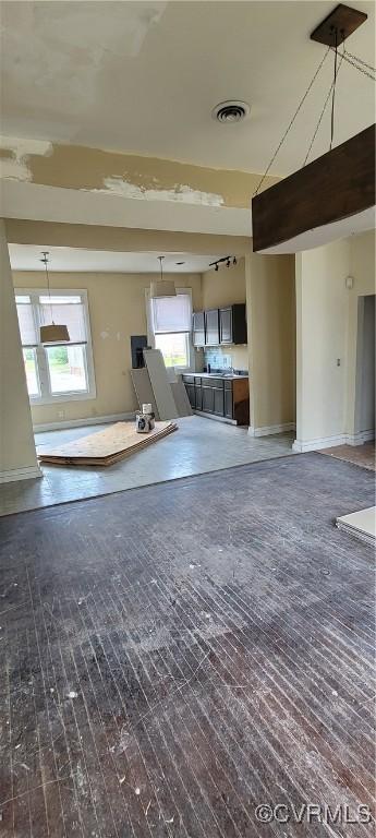 22 Corling St, Petersburg, VA 23803 - unfurnished living room featuring baseboards