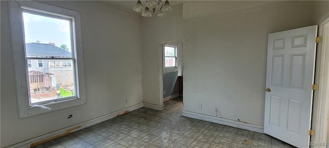 22 Corling St, Petersburg, VA 23803 - empty room featuring a chandelier and light flooring