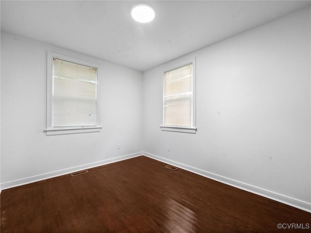 1627 Skipwith Rd, Henrico, VA 23229 - spare room featuring baseboards and dark wood-type flooring