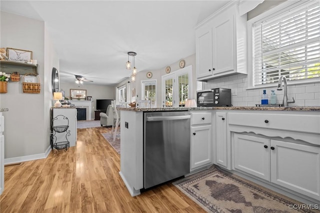 11830 Explorer Ct, Midlothian, VA 23114 - kitchen with dishwasher, plenty of natural light, a fireplace, and light wood-style floors