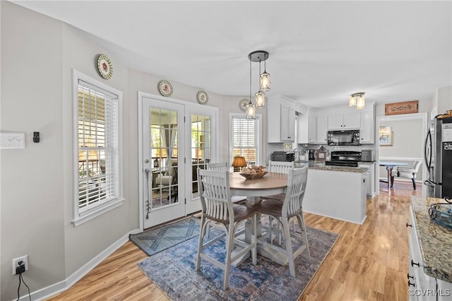 11830 Explorer Ct, Midlothian, VA 23114 - dining space with light wood-type flooring and baseboards