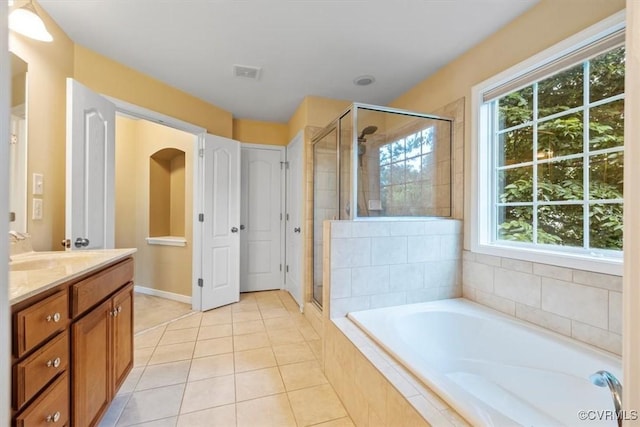 8738 New Holland Ln, Mechanicsville, VA 23116 - full bath with vanity, a bath, a stall shower, and plenty of natural light