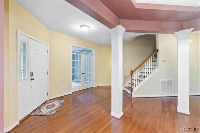 8738 New Holland Ln, Mechanicsville, VA 23116 - entrance foyer with decorative columns, wood finished floors, french doors, and stairs