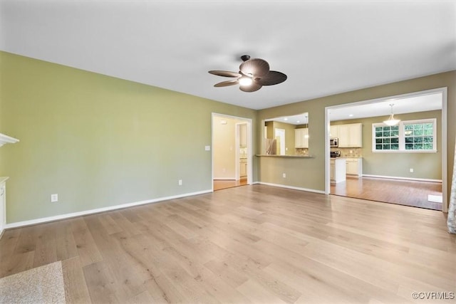 8738 New Holland Ln, Mechanicsville, VA 23116 - unfurnished living room with light wood-style flooring and ceiling fan