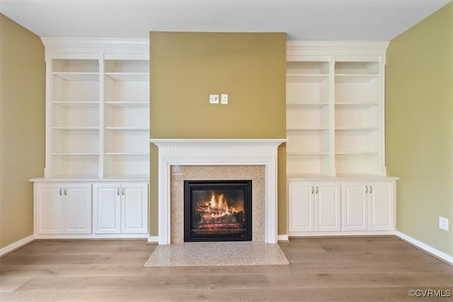 8738 New Holland Ln, Mechanicsville, VA 23116 - unfurnished living room featuring wood finished floors and a glass covered fireplace