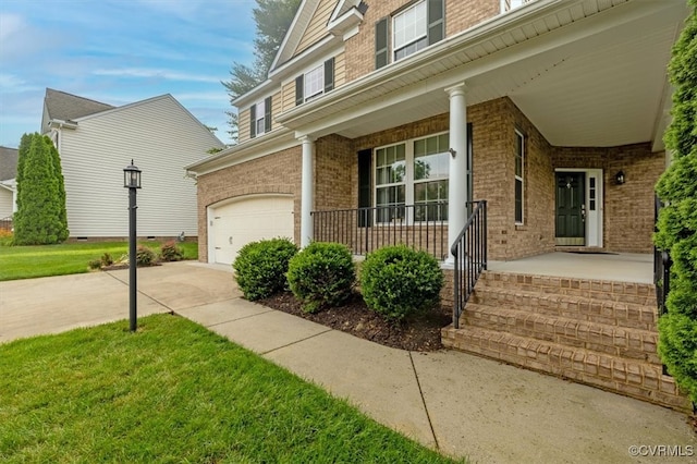 8738 New Holland Ln, Mechanicsville, VA 23116 - view of exterior entry featuring a porch, brick siding, and an attached garage