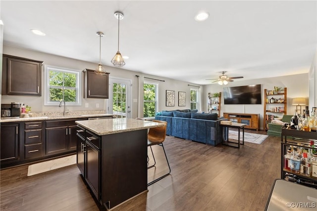 7318 Lancewood Ct, Chesterfield, VA 23832 - kitchen with open floor plan, dark brown cabinets, a ceiling fan, a kitchen island, and recessed lighting