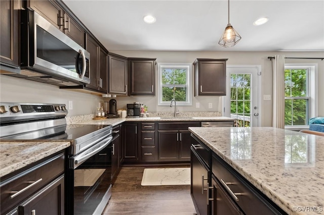 7318 Lancewood Ct, Chesterfield, VA 23832 - kitchen with appliances with stainless steel finishes, plenty of natural light, recessed lighting, dark brown cabinets, and dark wood-type flooring