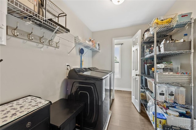 7318 Lancewood Ct, Chesterfield, VA 23832 - laundry room with washer and dryer and wood finished floors