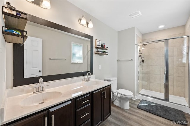 7318 Lancewood Ct, Chesterfield, VA 23832 - bathroom featuring wood finished floors, double vanity, and a shower stall