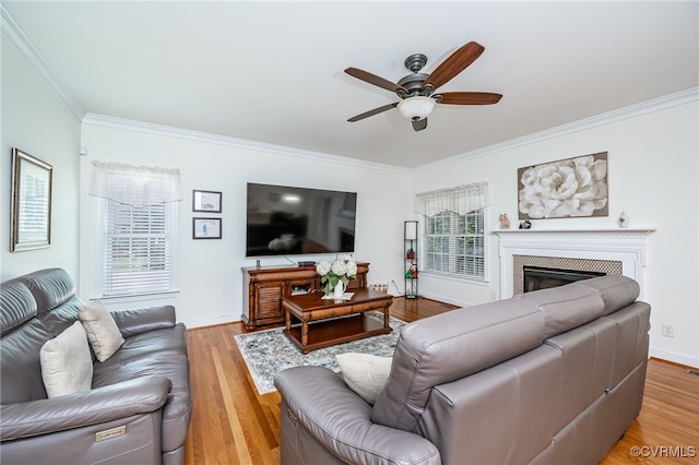 5020 Park Meadows Way, Glen Allen, VA 23059 - living area featuring ornamental molding, ceiling fan, a glass covered fireplace, and light wood-type flooring