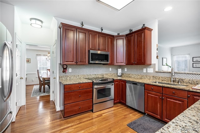 5020 Park Meadows Way, Glen Allen, VA 23059 - kitchen featuring stainless steel appliances, tasteful backsplash, light wood finished floors, light stone counters, and crown molding