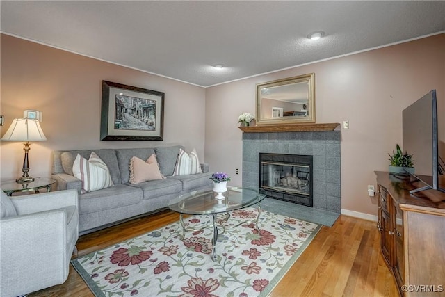 2711 Robson Ct, Henrico, VA 23233 - living room with wood finished floors, a fireplace, and crown molding