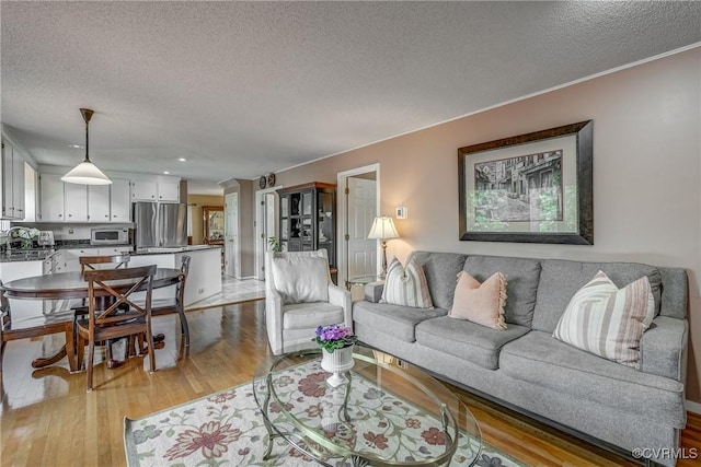 2711 Robson Ct, Henrico, VA 23233 - living area with a textured ceiling, light wood finished floors, and recessed lighting