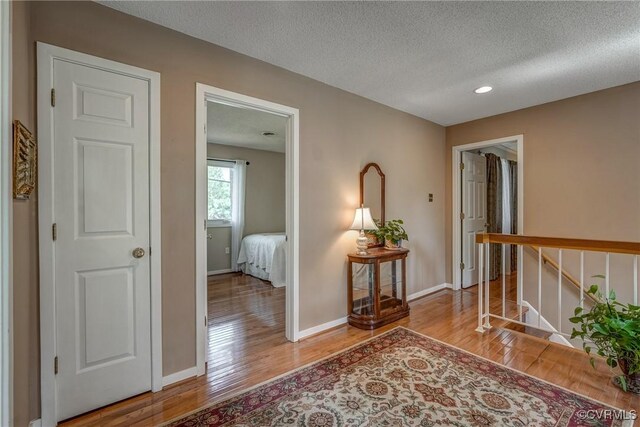 2711 Robson Ct, Henrico, VA 23233 - hallway featuring wood finished floors, a textured ceiling, and recessed lighting