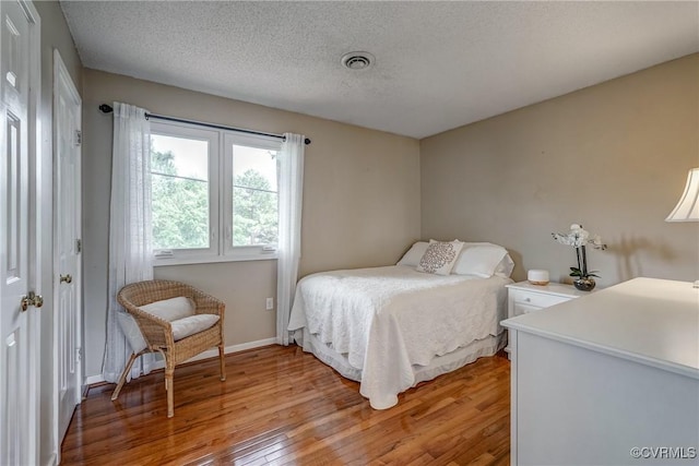 2711 Robson Ct, Henrico, VA 23233 - bedroom with light wood-style flooring and a textured ceiling