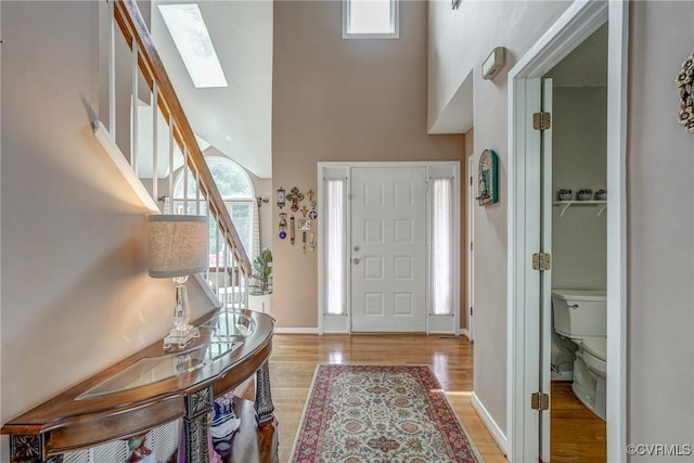 2711 Robson Ct, Henrico, VA 23233 - foyer featuring stairs, a high ceiling, wood finished floors, and a skylight