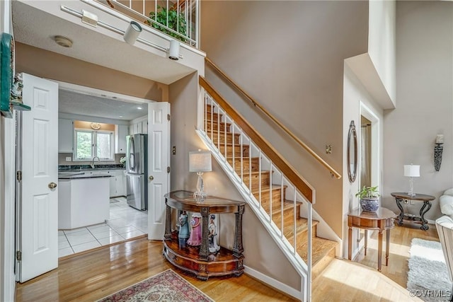 2711 Robson Ct, Henrico, VA 23233 - staircase with wood finished floors and a towering ceiling