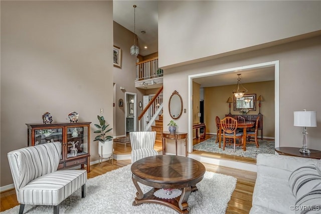 2711 Robson Ct, Henrico, VA 23233 - living room featuring a towering ceiling, wood finished floors, and stairs