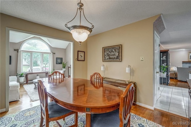 2711 Robson Ct, Henrico, VA 23233 - dining area featuring light wood-style flooring and a textured ceiling