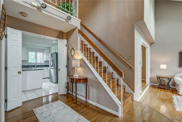 2711 Robson Ct, Henrico, VA 23233 - stairway with wood finished floors and a towering ceiling