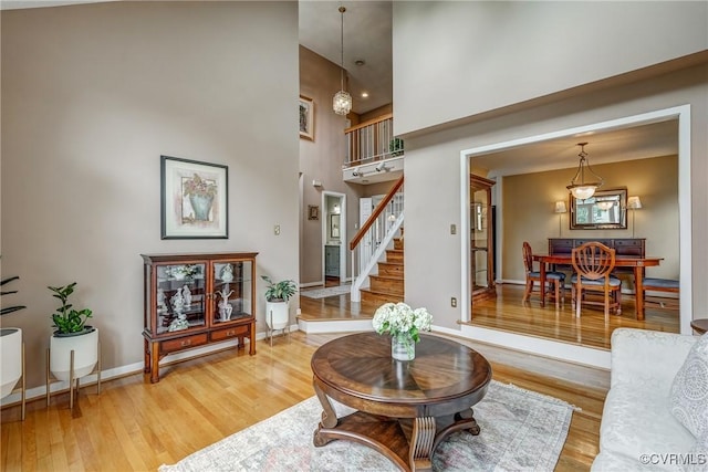 2711 Robson Ct, Henrico, VA 23233 - living room with a towering ceiling, light wood-style floors, and stairway