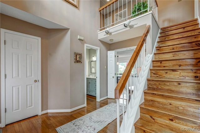 2711 Robson Ct, Henrico, VA 23233 - foyer entrance with stairway, hardwood / wood-style flooring, and a towering ceiling