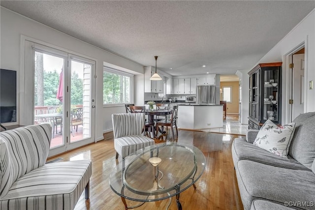 2711 Robson Ct, Henrico, VA 23233 - living area with a textured ceiling, light wood-style flooring, and recessed lighting