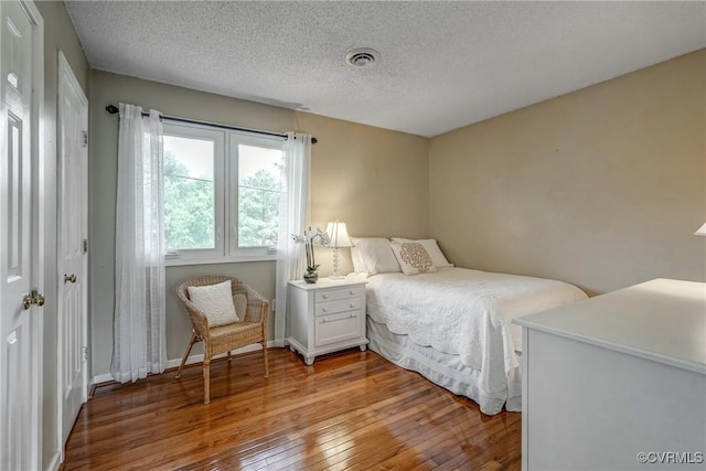 2711 Robson Ct, Henrico, VA 23233 - bedroom featuring light wood-style flooring and a textured ceiling