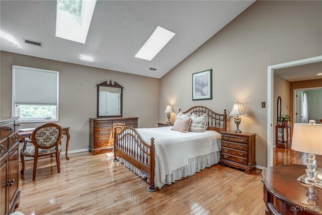 2711 Robson Ct, Henrico, VA 23233 - bedroom featuring a skylight, light wood-style flooring, and high vaulted ceiling
