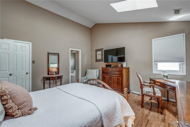 2711 Robson Ct, Henrico, VA 23233 - bedroom with high vaulted ceiling, light wood-type flooring, and a skylight