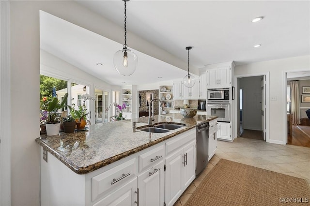 8950 Bellefonte Rd, Henrico, VA 23229 - kitchen featuring appliances with stainless steel finishes, white cabinetry, dark stone countertops, light tile patterned flooring, and recessed lighting