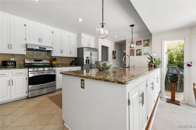 8950 Bellefonte Rd, Henrico, VA 23229 - kitchen featuring stainless steel appliances, under cabinet range hood, decorative backsplash, dark stone counters, and white cabinetry
