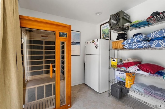 8950 Bellefonte Rd, Henrico, VA 23229 - kitchen featuring freestanding refrigerator, tile patterned floors, and a relaxing sauna
