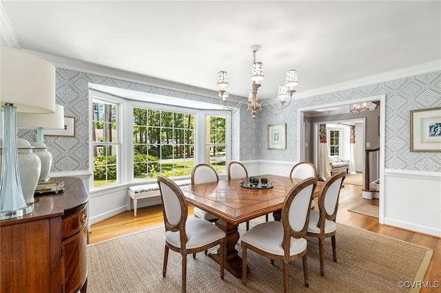 8950 Bellefonte Rd, Henrico, VA 23229 - dining area featuring wallpapered walls, ornamental molding, a chandelier, wood finished floors, and a wainscoted wall