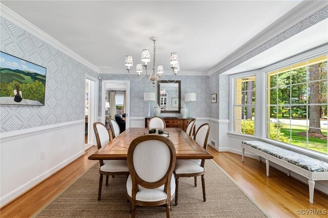 8950 Bellefonte Rd, Henrico, VA 23229 - dining area with a chandelier, plenty of natural light, ornamental molding, light wood-style floors, and wallpapered walls