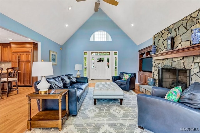 8467 Wendellshire Way, Mechanicsville, VA 23111 - living room with light wood finished floors, high vaulted ceiling, ceiling fan, a stone fireplace, and beamed ceiling